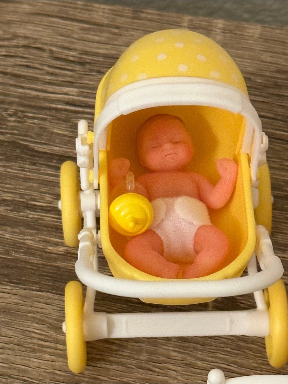 The Zuru My Mini Baby Series 1 Yellow Stroller set